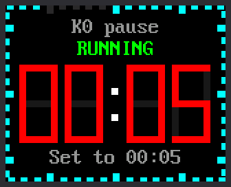 A countdown timer set to 5 seconds. Under the green word RUNNING, red digits count 00:05, 00:04, 00:03, 00:02, 00:01 while the cyan ticks around the edge go out. Then 00:00 flashes in red under the words TIME'S UP! and the bottom line says K0, PUSH or knob.