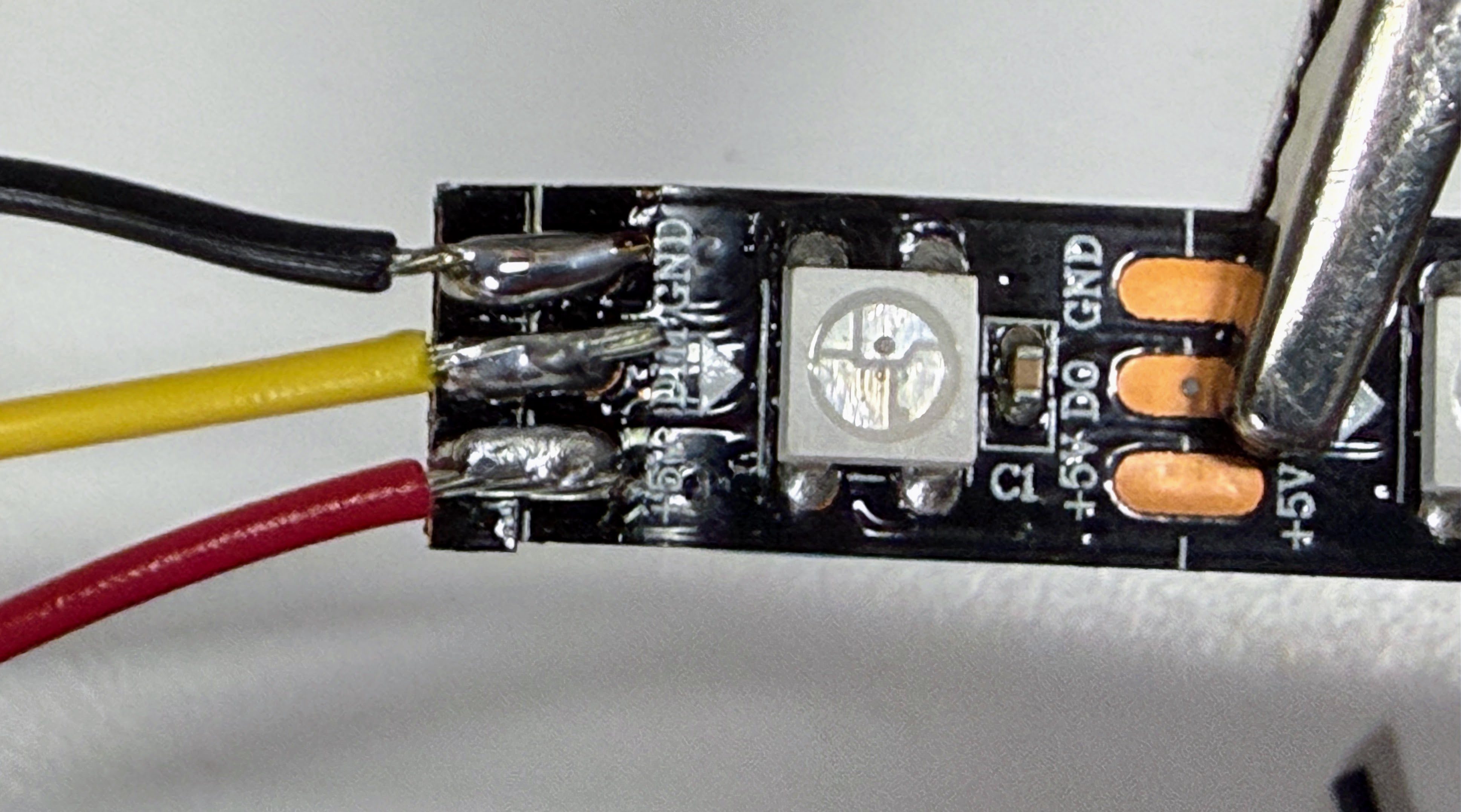 Wires soldered to the pads at the strip's cut end