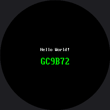 The words Hello World! in white small-font text above the word GC9B72 in large green bold text, both centered on the round black screen
